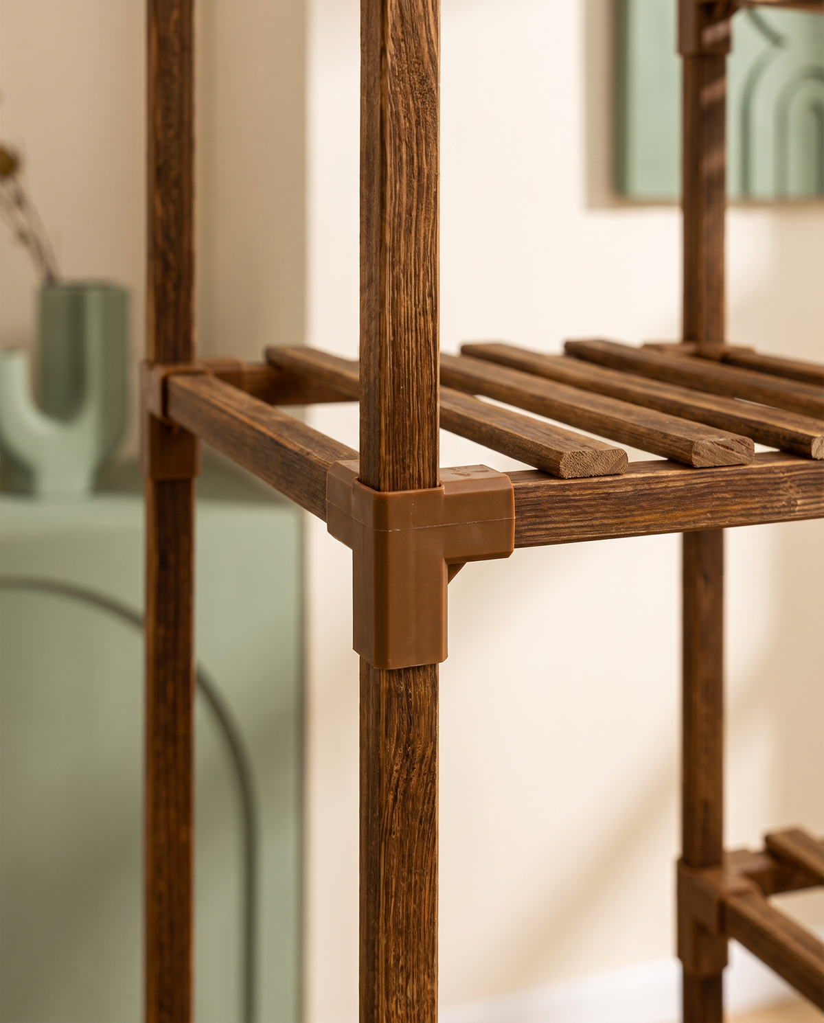 Close-up detail of the carbonized wood joint and slatted shelf construction